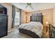 Relaxing bedroom featuring soft carpet, a plush bed, and sun-filled windows at 8531 Woodcrest Dr, Port Richey, FL 34668