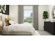 Bedroom with a large window, stylish decor, modern black dresser, and comfortable white linens at 8582 Linked Dr, New Port Richey, FL 34655
