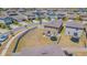 Aerial view of a home with spacious fenced backyard, landscaping, and a neighborhood setting at 9411 Lemon Drop Loop, Sun City Center, FL 33573