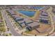 Aerial view showcasing the neighborhood, its landscaping, and the nearby pond adding to the community charm at 9411 Lemon Drop Loop, Sun City Center, FL 33573