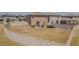 Expansive backyard with privacy fence, patio set, and trampoline, great for outdoor activities at 9411 Lemon Drop Loop, Sun City Center, FL 33573
