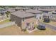 Aerial view of the backyard featuring a patio with outdoor furniture and fenced-in yard, perfect for relaxation at 9411 Lemon Drop Loop, Sun City Center, FL 33573