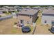 Spacious backyard featuring a patio for outdoor dining, great for entertaining guests and enjoying outdoor living at 9411 Lemon Drop Loop, Sun City Center, FL 33573