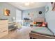 Bedroom with carpeted floor, window and light blue walls, and youthful decor at 9411 Lemon Drop Loop, Sun City Center, FL 33573