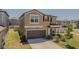 Well maintained two-story home with a two-car garage and inviting front porch. Beautifully landscaped lawn at 9411 Lemon Drop Loop, Sun City Center, FL 33573