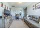 Comfortable living room with modern furniture, carpeted floor, and a neutral color scheme at 9411 Lemon Drop Loop, Sun City Center, FL 33573