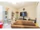 Inviting living room featuring neutral walls and a comfortable-looking sofa, perfect for relaxation at 9411 Lemon Drop Loop, Sun City Center, FL 33573