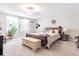 Bright main bedroom with carpet flooring, decorated with plants and tasteful decor at 9411 Lemon Drop Loop, Sun City Center, FL 33573