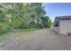 Lush backyard with mature trees and green space at 10319 Widgeon Way, New Port Richey, FL 34654