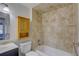 Well-lit bathroom showcasing a tiled shower and a modern vanity at 10319 Widgeon Way, New Port Richey, FL 34654