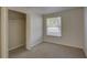 Bright bedroom with closet and large window at 10319 Widgeon Way, New Port Richey, FL 34654