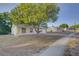 A single-story home with a well-maintained yard and a beautiful shade tree at 10319 Widgeon Way, New Port Richey, FL 34654