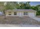 Charming single-story home featuring a manicured lawn and inviting front entrance at 10319 Widgeon Way, New Port Richey, FL 34654