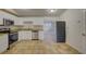 Modern kitchen featuring stainless steel appliances and granite countertops at 10319 Widgeon Way, New Port Richey, FL 34654
