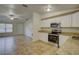 Bright kitchen featuring modern appliances and light, airy finishes at 10319 Widgeon Way, New Port Richey, FL 34654