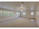 Bright living room with many windows and tile entryway at 10319 Widgeon Way, New Port Richey, FL 34654