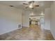 Spacious living room showcasing the open floor plan to the modern kitchen at 10319 Widgeon Way, New Port Richey, FL 34654