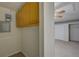 Hall view that opens up to a room with carpet flooring and cabinets at 10319 Widgeon Way, New Port Richey, FL 34654