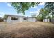Spacious backyard with a partial fence and shed at 10602 Camelia Dr, Port Richey, FL 34668