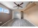 Bedroom showcasing neutral paint, a ceiling fan, and a closet at 10602 Camelia Dr, Port Richey, FL 34668