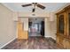 View of the living room with wood floors open to the kitchen at 10602 Camelia Dr, Port Richey, FL 34668