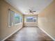 Living room featuring wood floors, neutral paint, and natural light at 10602 Camelia Dr, Port Richey, FL 34668