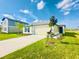 Charming single-story home featuring a manicured lawn, a driveway, and a two-car garage at 11257 Linden Depot Rd, San Antonio, FL 33576