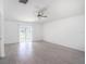 This spacious living room has tile floors and sliding doors to the outside at 11257 Linden Depot Rd, San Antonio, FL 33576