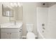 Bright bathroom featuring a modern vanity, toilet, and bathtub with white tiled walls at 11323 Ivy Flower Loop, Riverview, FL 33578