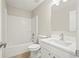 Clean bathroom featuring a white vanity with a tub and shower combo with tiled walls at 11323 Ivy Flower Loop, Riverview, FL 33578