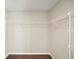 Walk-in closet with wire shelves and wood-look flooring at 11323 Ivy Flower Loop, Riverview, FL 33578