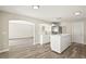 Bright kitchen with stainless steel appliances, white cabinets, modern countertop and open layout at 11323 Ivy Flower Loop, Riverview, FL 33578