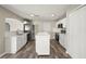Bright kitchen features an island, stainless steel appliances, and white cabinets offering plentiful storage at 11323 Ivy Flower Loop, Riverview, FL 33578