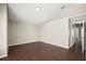 Spacious living room with hardwood floors, neutral walls, and ample natural light at 11323 Ivy Flower Loop, Riverview, FL 33578