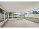 Large screened-in porch with tile flooring, offering outdoor living and entertaining at 11323 Ivy Flower Loop, Riverview, FL 33578