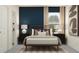 Stylish bedroom with a modern bed, chic lighting, and tasteful artwork on the walls at 11745 E 71St Ter, Palmetto, FL 34221