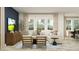 Cozy living room with modern furniture, large windows, and neutral color palette at 11745 E 71St Ter, Palmetto, FL 34221