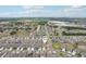 Aerial view of a suburban neighborhood featuring organized streets, houses, and green spaces at 13055 Willow Grove Dr, Riverview, FL 33579