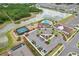 An aerial view of the community amenities including tennis courts, playground, pool, clubhouse and parking at 13055 Willow Grove Dr, Riverview, FL 33579