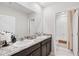 Elegant bathroom with double sinks, granite countertops, and modern fixtures offers a luxurious and functional space at 13055 Willow Grove Dr, Riverview, FL 33579