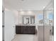 A bright bathroom features a double sink and sleek design, with natural light enhancing its appeal at 13055 Willow Grove Dr, Riverview, FL 33579