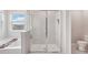 Modern bathroom with a glass enclosed shower and fixtures offers a sleek and functional design at 13055 Willow Grove Dr, Riverview, FL 33579