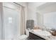 Clean bathroom with a glass-enclosed shower, granite counters, and modern fixtures at 13055 Willow Grove Dr, Riverview, FL 33579