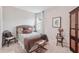Cozy bedroom featuring a decorative headboard, comfortable bedding, and neutral decor at 13055 Willow Grove Dr, Riverview, FL 33579