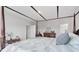 A beautifully furnished bedroom with a canopy bed and classic decor radiates comfort and timeless style at 13055 Willow Grove Dr, Riverview, FL 33579
