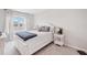 Cozy bedroom with white wooden frame bed, large window and soft décor exudes warmth and relaxation at 13055 Willow Grove Dr, Riverview, FL 33579