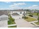 Beautiful two-story home showcasing a well-manicured front lawn, double garage, and inviting curb appeal at 13055 Willow Grove Dr, Riverview, FL 33579