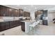 Spacious kitchen featuring granite countertops, stainless appliances, and a center island with seating at 13055 Willow Grove Dr, Riverview, FL 33579