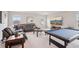 Large living room featuring comfortable seating, a TV, and a pool table for entertainment at 13055 Willow Grove Dr, Riverview, FL 33579