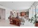 Bright living room featuring tile floors, neutral walls, modern furnishings, and lots of space at 13055 Willow Grove Dr, Riverview, FL 33579